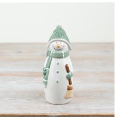 Add some festive charm to your home with this delightful standing snowman decoration.