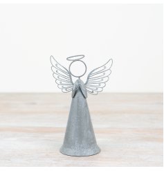 Add a touch of traditional elegance to any festive decor with this charming rustic metal angel ornament. 