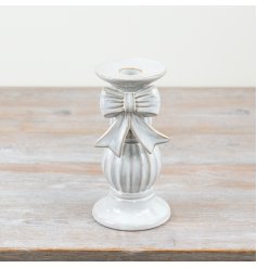Add a touch of charm to any living space with our delightful ceramic candle holder.