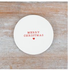 A delightful ceramic coaster embossed with the phrase "Merry Christmas" in a vibrant red font