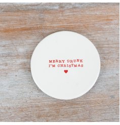 A ceramic coaster featuring the quote "Merry Drunk I'm Christmas"