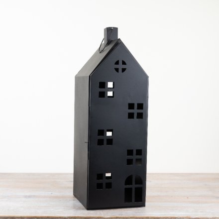 Add charm to any space with this rustic candle holder lantern, featuring a unique house design. 