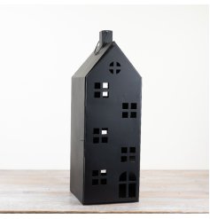 Add charm to any space with this rustic candle holder lantern, featuring a unique house design. 