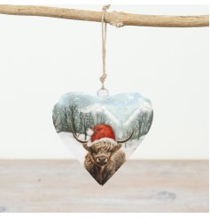 Add a touch of countryside charm to the home with this delightful highland cow heart decoration