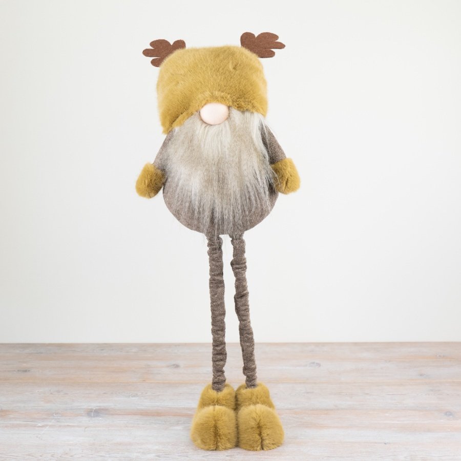 A stunning woodland gonk decoration in rich ochre and brown colours. Soft to touch with faux fur details. 