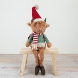 Meet the adorable and hardy festive Highland Cow - a perfect addition to your seasonal decor!