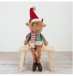 Introducing this rugged and extremely cute Christmas Highland Cow. 