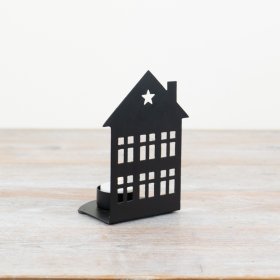 Introduce a touch of rustic elegance to any living space with this black iron house t-light holder. 