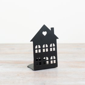 Add a touch of rustic elegance to the home with this charming house tea light holder. 