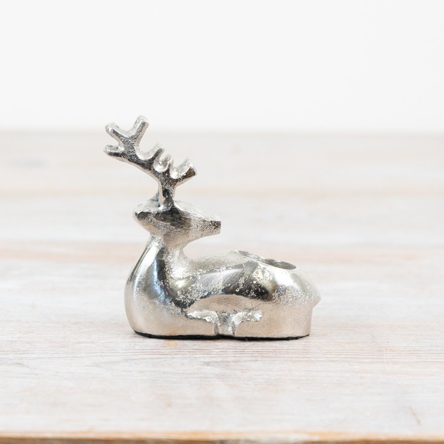 Illuminate your holiday celebration with our beautiful Reindeer Candle Holder.