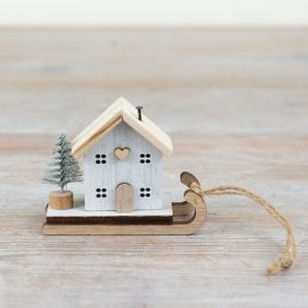 Add some festive charm to the home with this delightful wooden sleigh and miniature house decoration. 