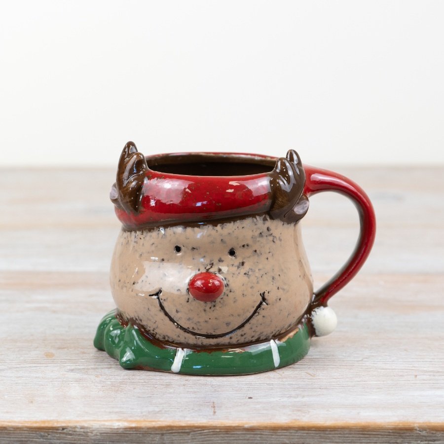 Introducing our charming reindeer mug, featuring a traditional rustic design with a cute red nose and antlers. The perfe