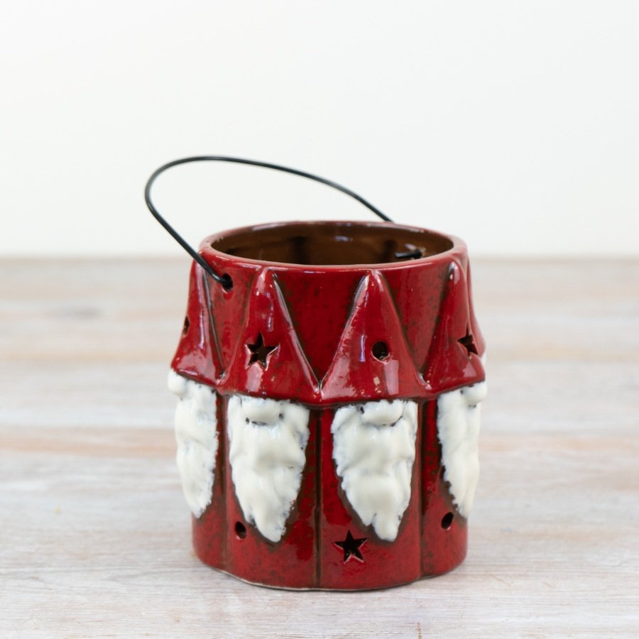 Illuminate the home with a touch of festive charm with our charming red gonk lantern.