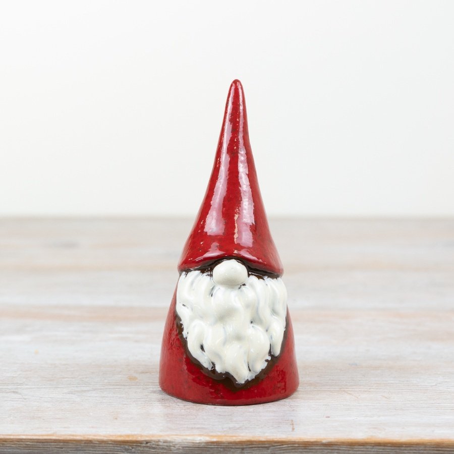 Add a touch of charm to any Christmas collection with this charming red rustic gonk ornament.