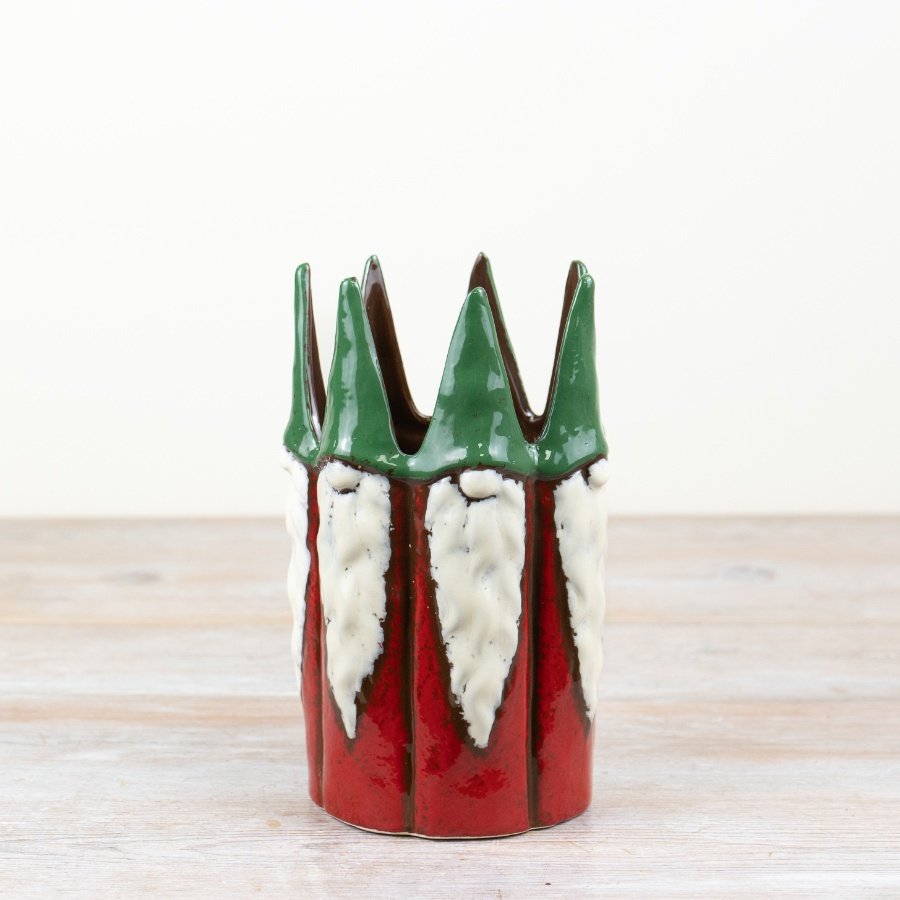 A charming gonk planter, complete with tall emerald hats and a red body.