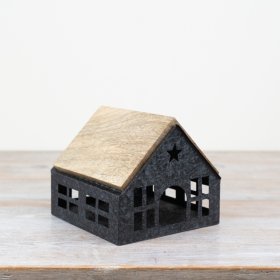 Our charming rustic iron house is complete with a beautiful wooden roof and intricate cut-out windows.