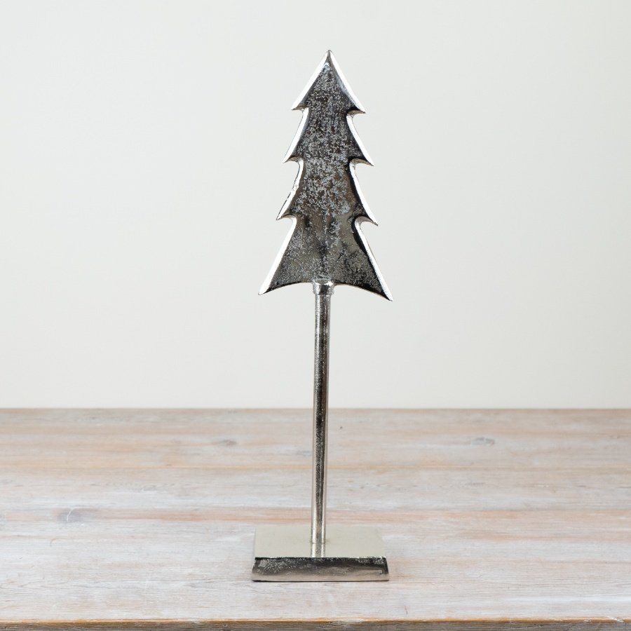 Introducing our stunning, tall Christmas tree complete with a sleek silver metal stand