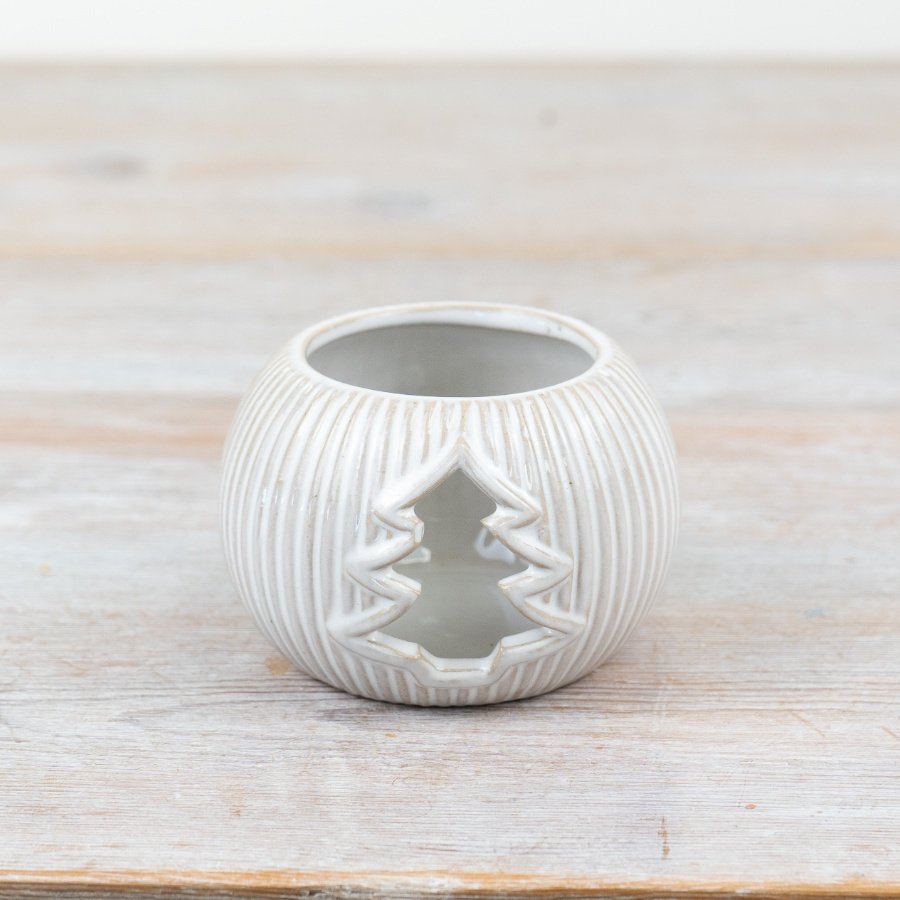 Add a touch of festive charm with this elegant tea light holder. Neutral colour with reactive glaze for a unique finis