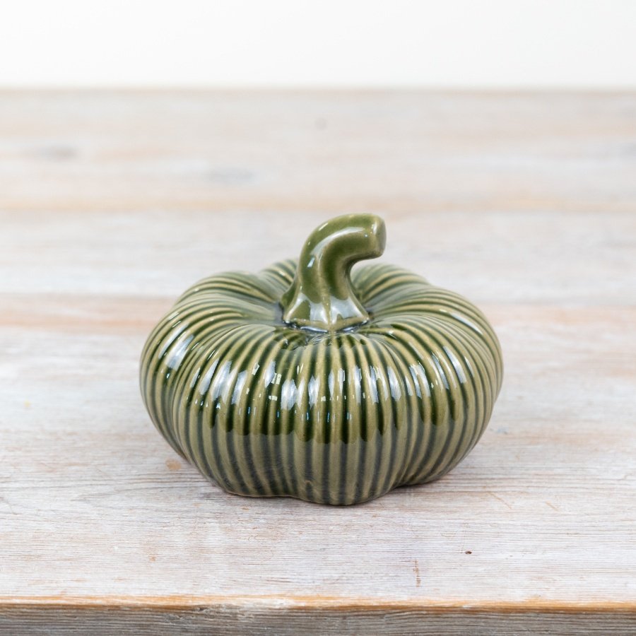 Enhance your home decor with our exquisite green porcelain pumpkin. 