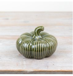 Add a touch of elegance to your home decor with our beautiful green porcelain pumpkin,