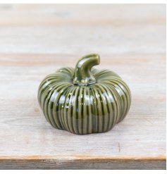 Add a touch of elegance to your autumn decor with our beautiful green porcelain pumpkin