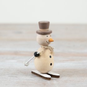 A charming wooden snowman with skis - the perfect addition to any home this holiday season!