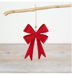 Add a classic touch to any holiday decorations with this elegant red metal bow hanger.