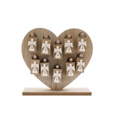 A charming assortment of wooden angel plaques displayed on a natural wooden stand. 