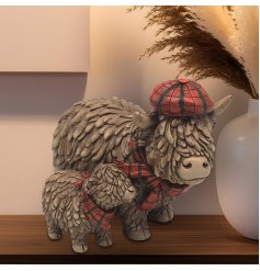 Bring home a piece of the Scottish countryside with our charming Highland Cow and Baby Ornament. 
