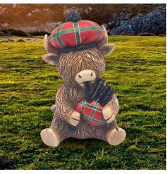 Experience the delight of Scotland with our Highland Cow Piper Ornament – the perfect accent piece for any home!