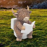 Add a quirky touch to your decor with the Highland Cow Reading On Toilet Ornament 