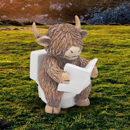 Enhance your home decor with a unique Highland Cow reading on toilet ornament.