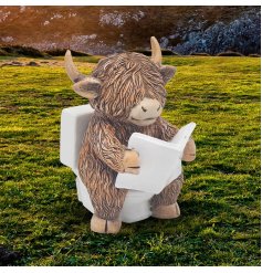 Add a quirky touch to your decor with the Highland Cow Reading On Toilet Ornament 