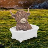 Take a playful trip to the countryside with our Highland Cow Soaking In Bath Ornament 