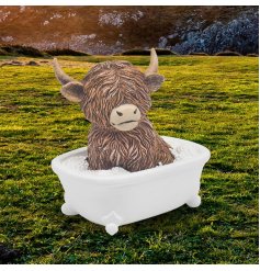 Take a playful trip to the countryside with our Highland Cow Soaking In Bath Ornament 