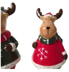 An assortment of 2 standing reindeers dressed head to toe in festive, warm clothing. 