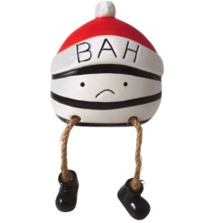A novelty ceramic shelf sitter. A humorous gift item and seasonal decoration. 