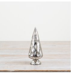 A silver metal tree with a rustic hammered effect finish
