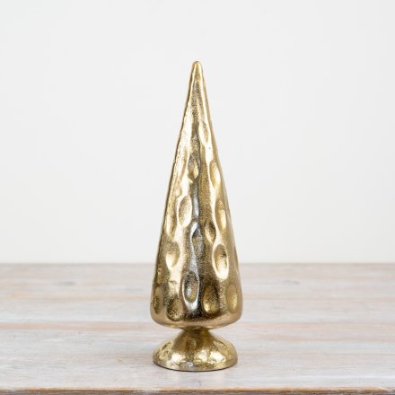 A rustic and simple gold tree ornament with a hammered effect finish.