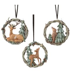 A mix of 3 hanging wreaths, each with a woodland animal and forest detailing. 