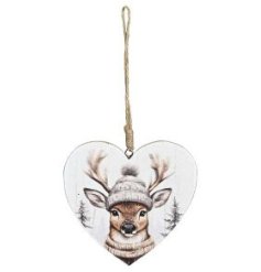A classic heart shaped metal hanger featuring a whimsical winter forest design with reindeer. 