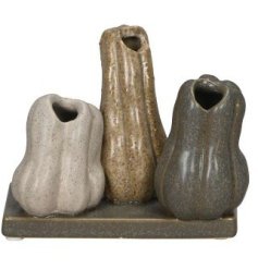 A beautiful decorative collection of pumpkin vases, each with an earthy speckled glaze. 