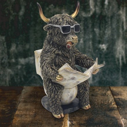 Add a touch of humor to your home with a quirky highland cow figurine perched on a toilet.