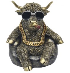 Add a unique Scottish touch to your home with our Chilling Highland Cow figurine.