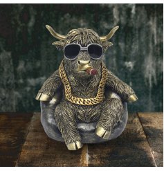 Bring a touch of Scotland to your home with our Highland Cow Chilling figurine