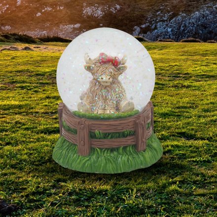 Infuse your decor with Scottish flair - introducing the Highland Cow Tartan bow waterglobe