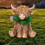 Bringing the Scottish countryside into your home with our charming Highland Cow With Thistle Ornament 