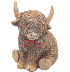 Add a touch of Scotland to your collection with this charming cow figurine.