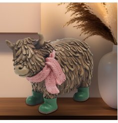  a chafrming highland cow figurine wearing wellies 