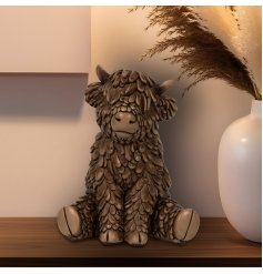 Meet Hughie, the cuddly cow with a Scottish charm! Perfect for any space